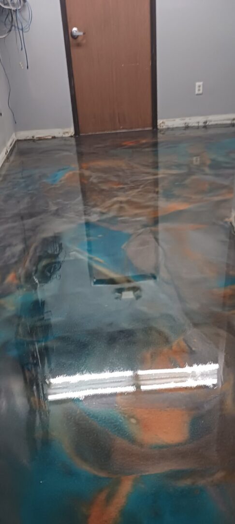 A table with a blue and brown painting on it.