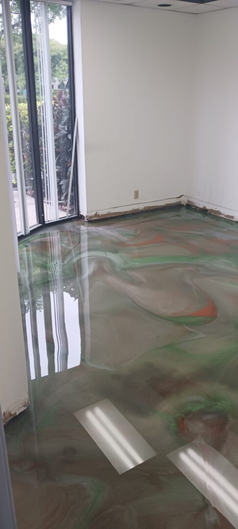 A flooded room with green water on the floor.