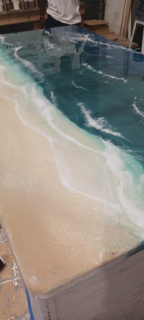 A beach with waves crashing on it's shore.