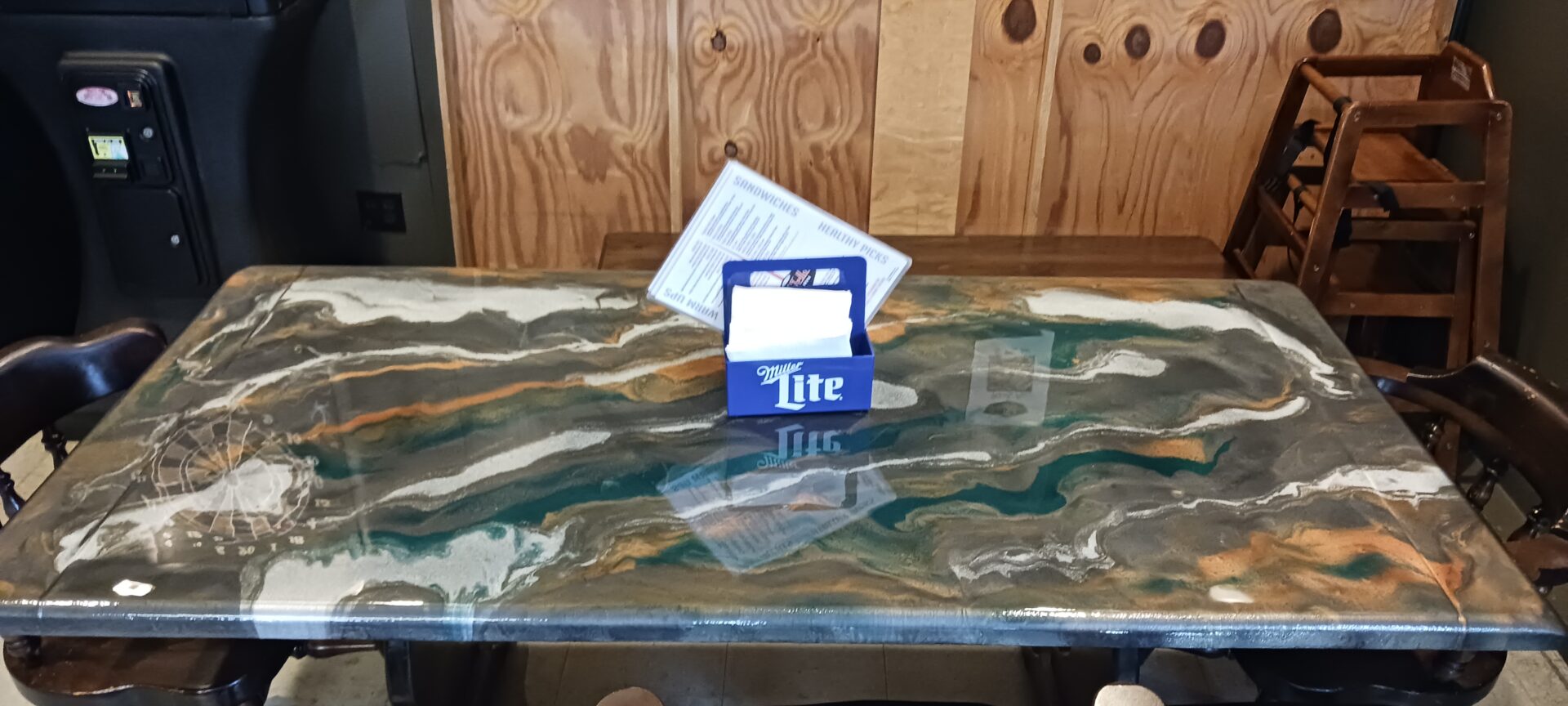 A table with a glass top and two cards on it.