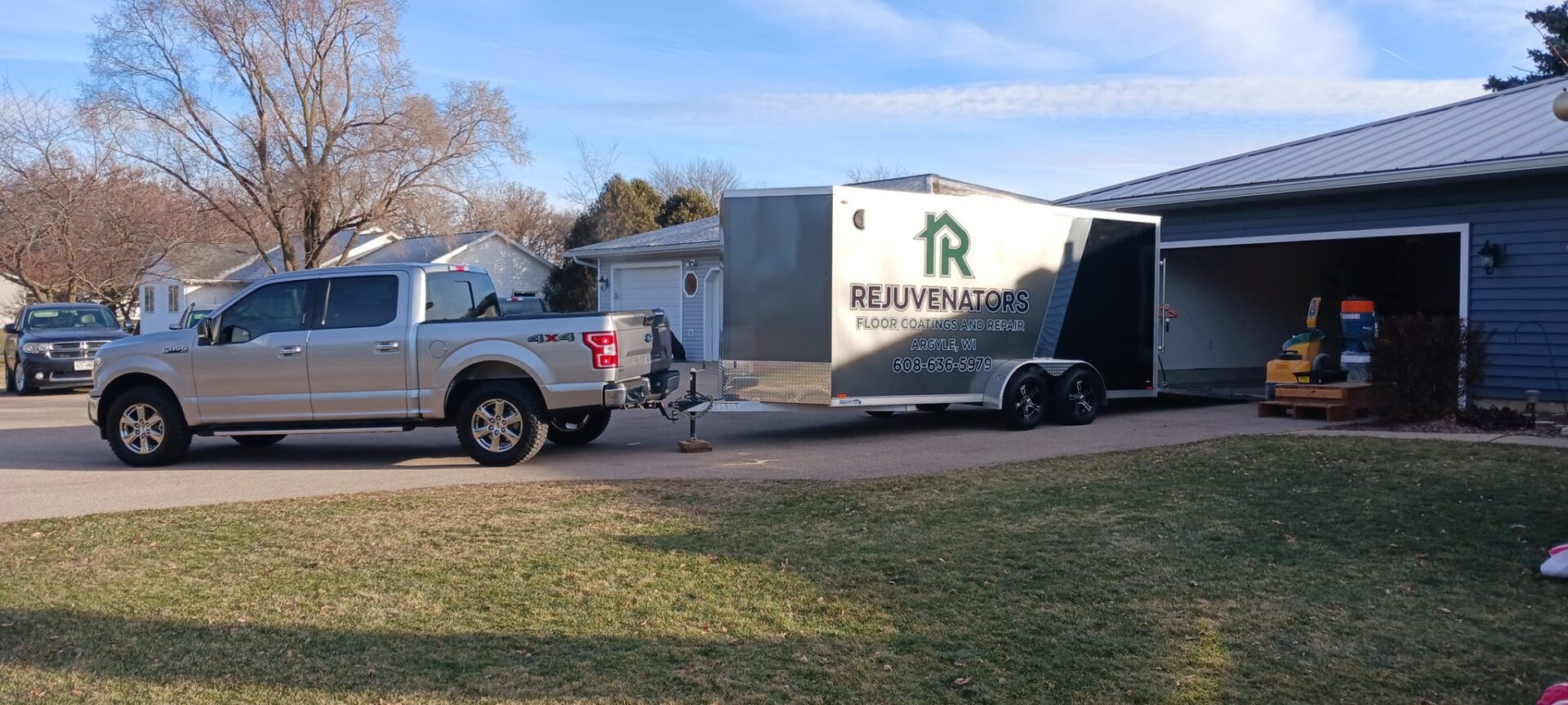 A truck pulling a trailer with a house on it.