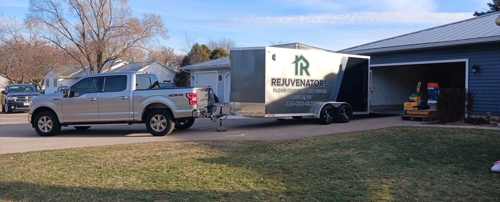 A truck pulling a trailer with a house on it.