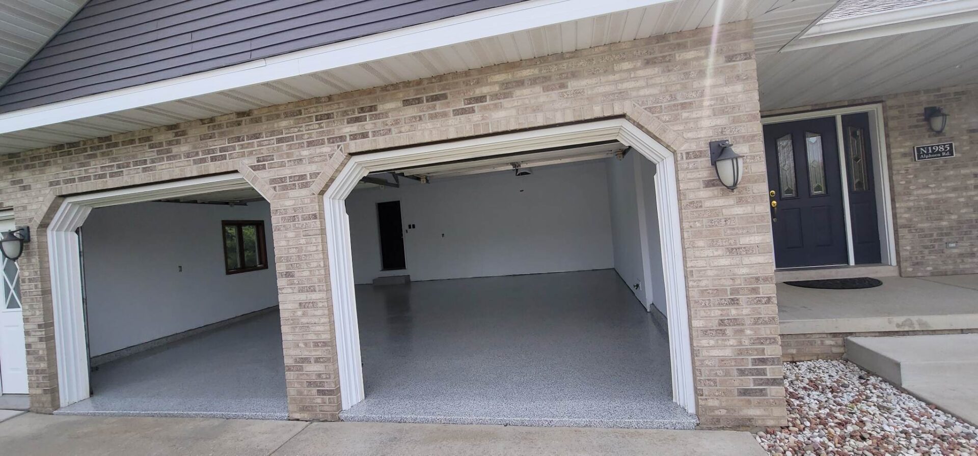 A garage with two doors and no windows.